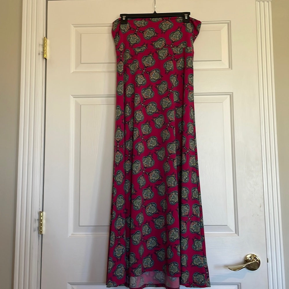 LulaRoe maxi skirt. Beautiful dark pink color with blue, and yellow pattern.